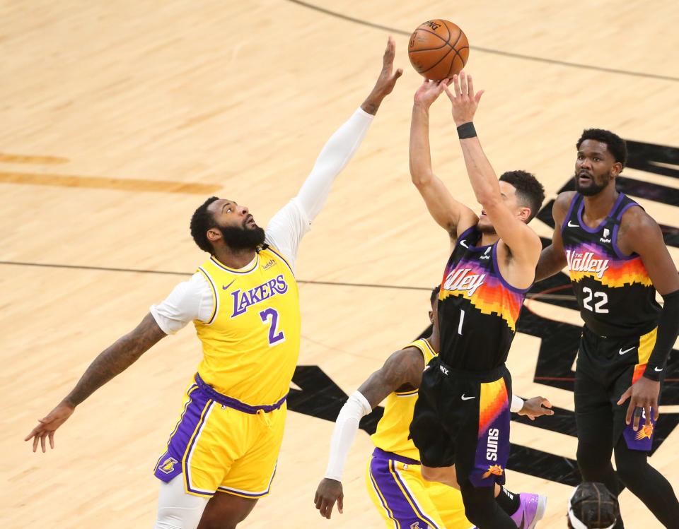 Andre Drummond blocks a shot by Devin Booker.