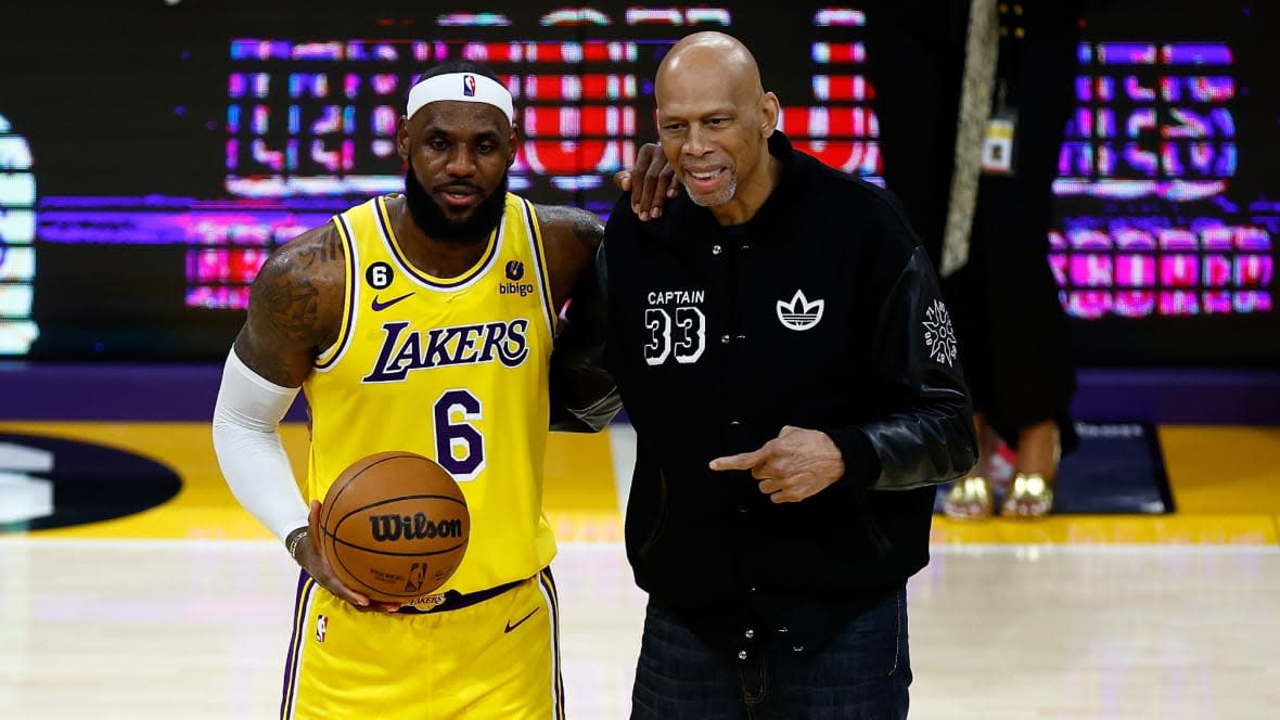 Kareem Abdul-Jabbar ceremoniously hands LeBron James #6 of the Los Angeles Lakers the ball after James passed Abdul-Jabbar to become the NBA’s all-time leading scorer, surpassing Abdul-Jabbar’s career total of 38,387 points against the Oklahoma City Thunder at Crypto.com Arena on February 07, 2023 in Los Angeles, California.