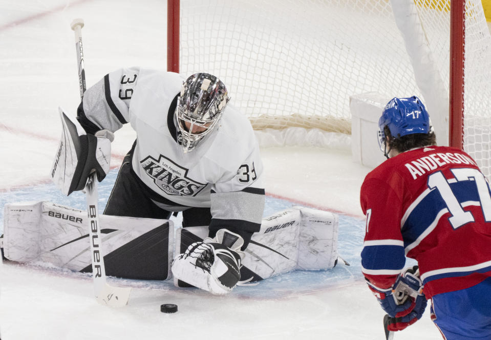 Los Angeles Kings goaltender Cam Talbot (39) makes a save against Montreal Canadiens' Josh Anderson (17) during the second period of an NHL hockey game Thursday, Dec. 7, 2023, in Montreal. (Christinne Muschi/The Canadian Press via AP)