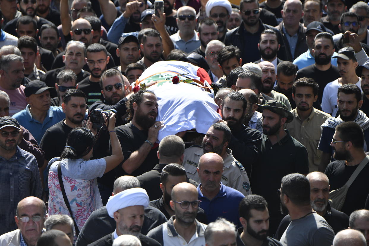 People attend the funeral ceremony of Reuters journalist Issam Abdallah, who was killed by Israeli forces while working in southern Lebanon in Khiam town of Nabatieh Governorate, Lebanon, on Oct. 14.