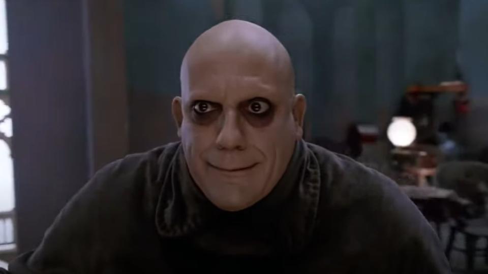 Christopher Lloyd as Uncle Fester making a silly face in The Addams Family.