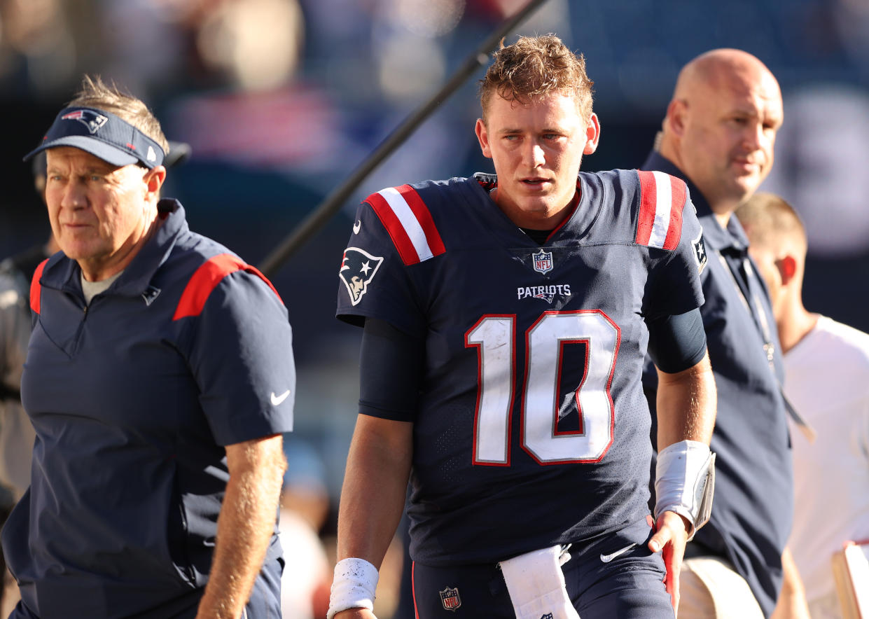 FOXBOROUGH, MASSACHUSETTS - SEPTEMBER 26: Head coach Bill Belichick and Mac Jones #10 of the New England Patriots walk off the field after the loss to the New Orleans Saints at Gillette Stadium on September 26, 2021 in Foxborough, Massachusetts. (Photo by Elsa/Getty Images)