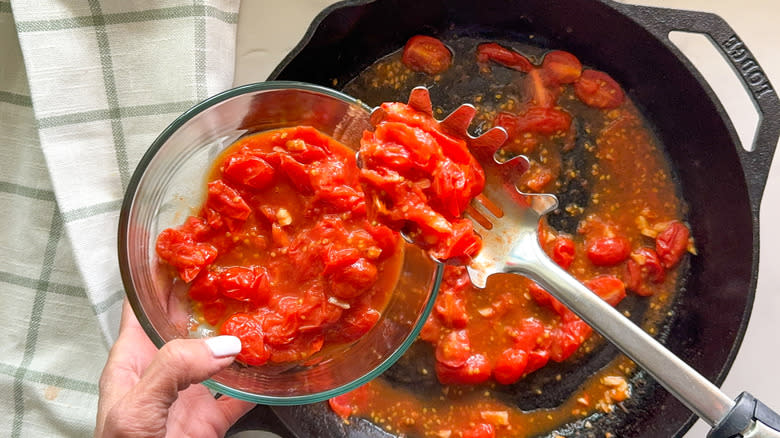 scooping out the tomatoes