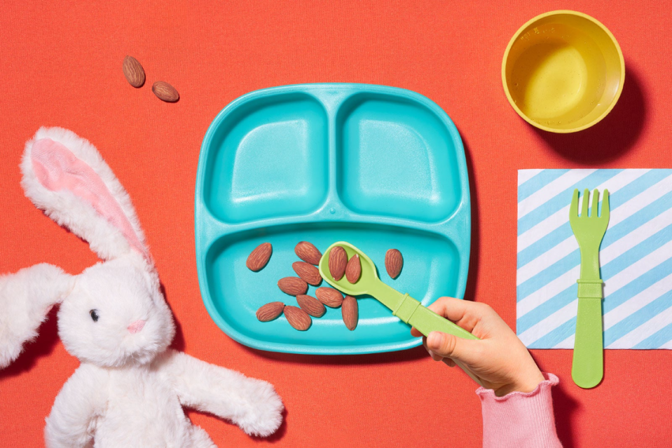 A children's lunch tray with almonds on it