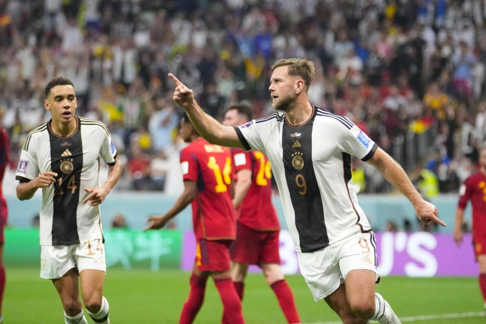 Germany's Niclas Fuellkrug celebrates after he scored his side's first goal during the World Cup group E football match between Spain and Germany, at the Al Bayt Stadium in Al Khor , Qatar, Sunday, Nov. 27, 2022. (AP Photo/Luca Bruno)