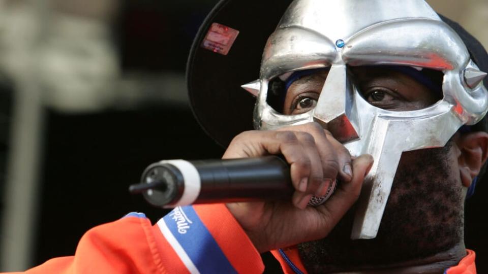 In this June 2005 photo, rapper MF DOOM performs at a benefit concert for the Rhino Foundation at Central Park’s Rumsey Playfield in New York City. The MC died in October, his wife announced on Instagram. (Photo by Peter Kramer/Getty Images)