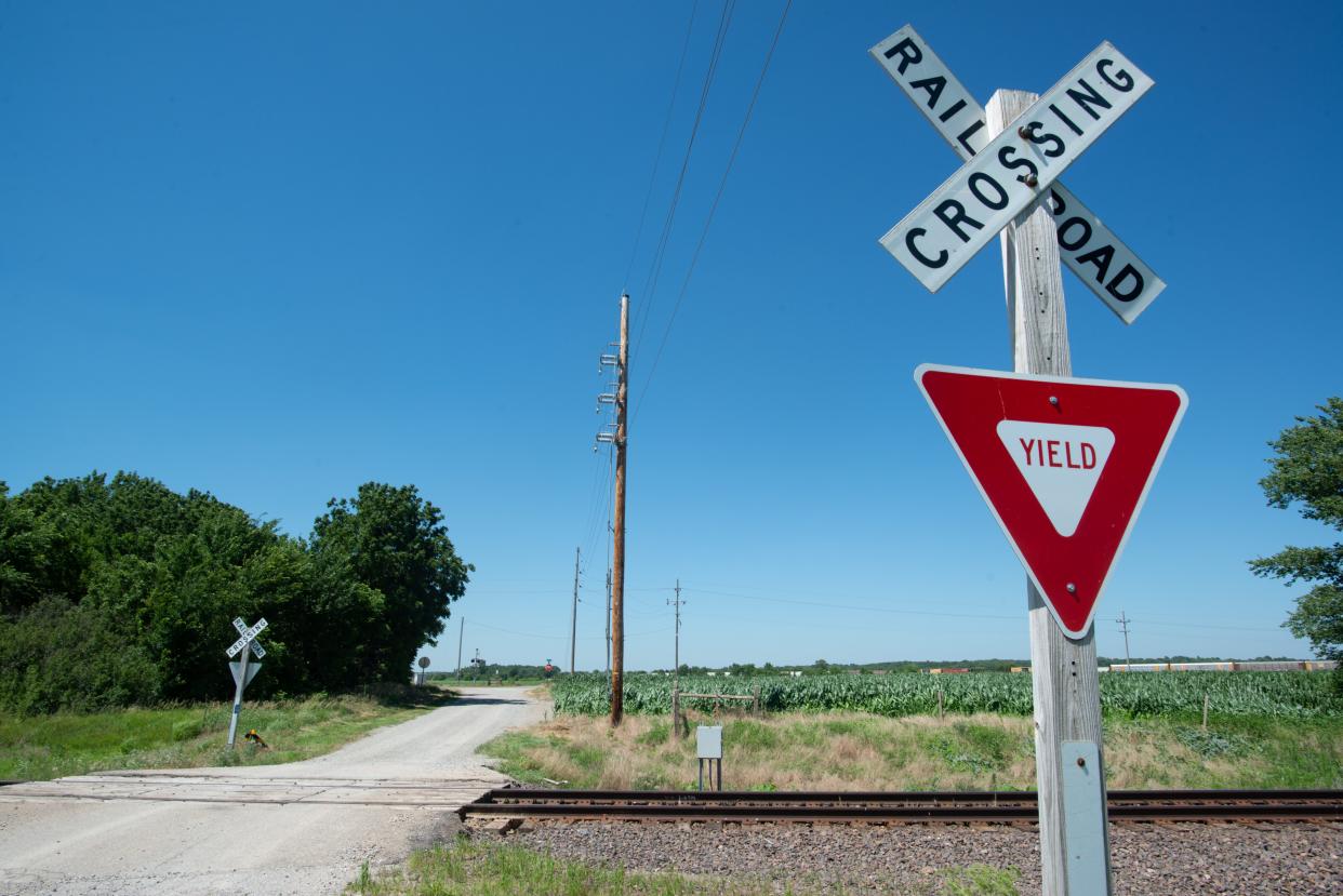 Two signs on either side of railroad tracks running through N.W. Countryside Road northwest of Topeka is all the warning drivers see as they drive across.