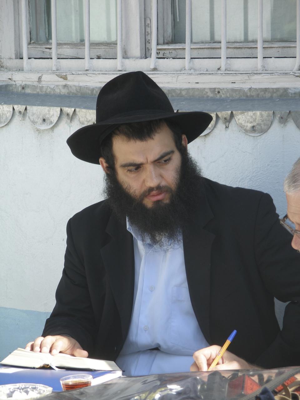 FILE - This photo shows Rabbi Ovadia Isakov as he speaks to a journalist in Derbent, Russia, on Thursday, Sept. 26, 2005. He was shot by a gunman on Wednesday, July 24, 2013, but recovered. Jews in the predominantly Muslim region of Dagestan in southern Russia say they are determined to regroup and rebuild following a deadly attack by Islamic militants on June 23 on Christian and Jewish houses of worship in Derbent and the regional capital of Makhachkala. (Natalya Krainova)/NewsTeam via AP)