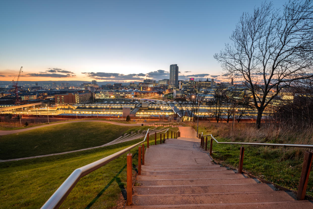 The skyline of Sheffield city centre seen from South Street Park above the city's main rail station, South Yorkshire, England UK