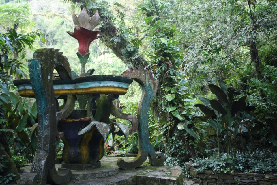 This Jan. 31, 2014 photo shows a flower sculpture in Las Pozas, a dreamy, little-known garden of surreal art, where sculptures evoke the ruins of ancient Greece but are overrun by exotic plants in Mexico’s northeast jungle. Las Pozas is located on a 100-acre (40-hectare) hillside where the Sierra Madre mountains and coastal plains of the northeast state of San Luis Potosi meet. (AP Photo/Teresa de Miguel Escribano)