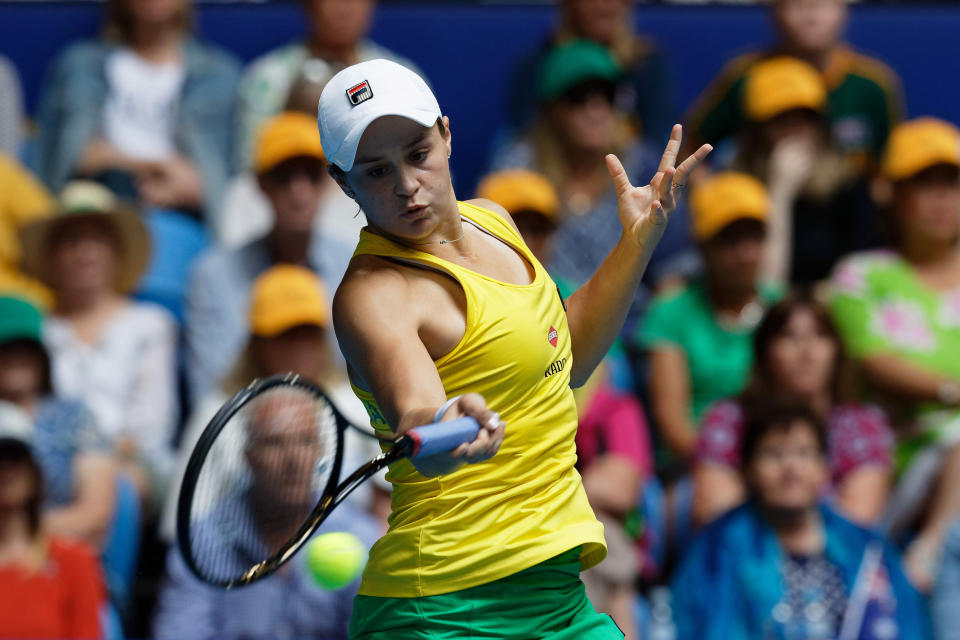 Australia's Ash Barty plays a shot to France's Kristina Mladenovic during their Fed Cup tennis final in Perth, Australia, Sunday, Nov. 10, 2019. (AP Photo/Trevor Collens)