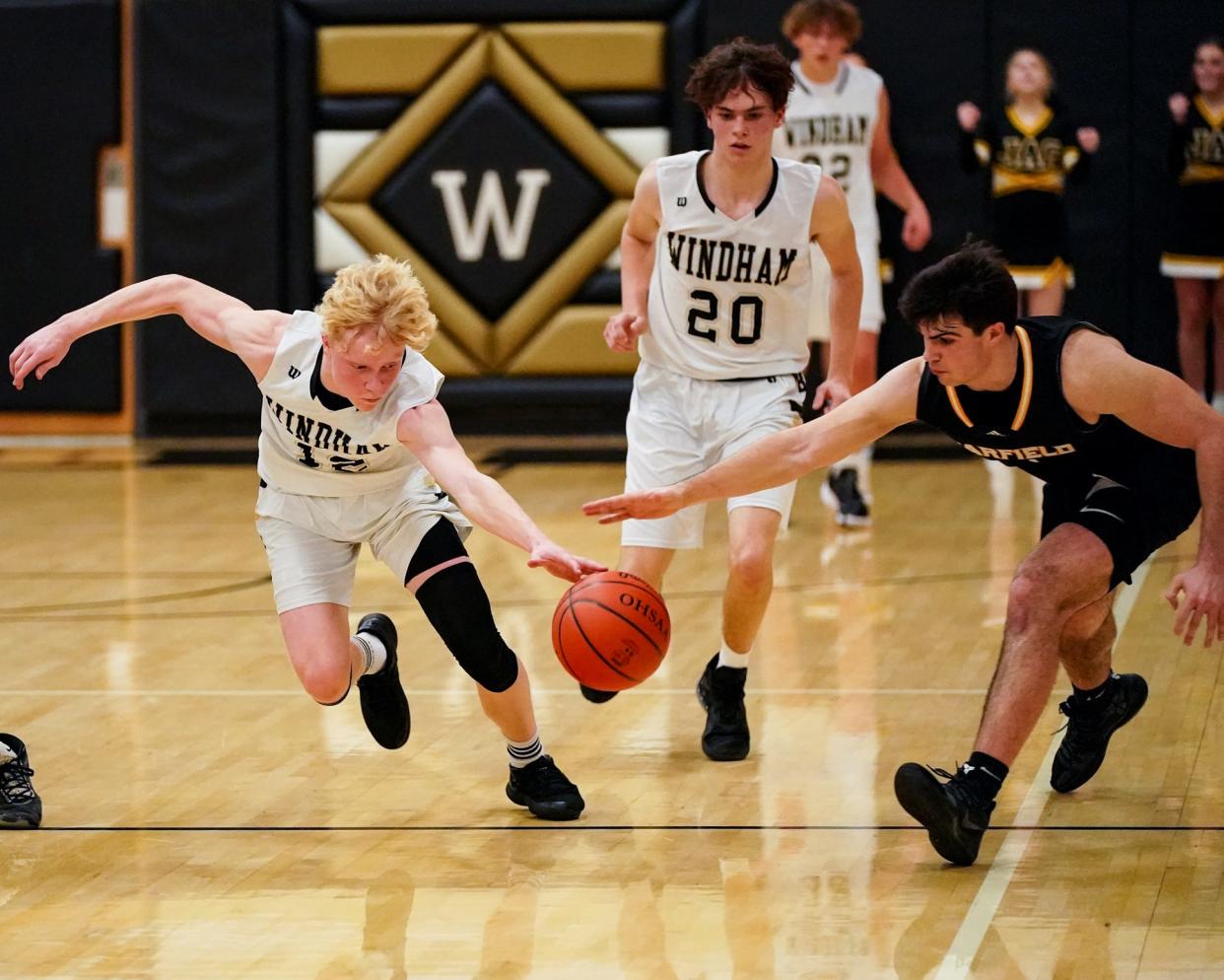 Windham's Chase Eye goes in for the steal and chases the ball downcourt against Garfield for a layup at Windham on December 3, 2021.