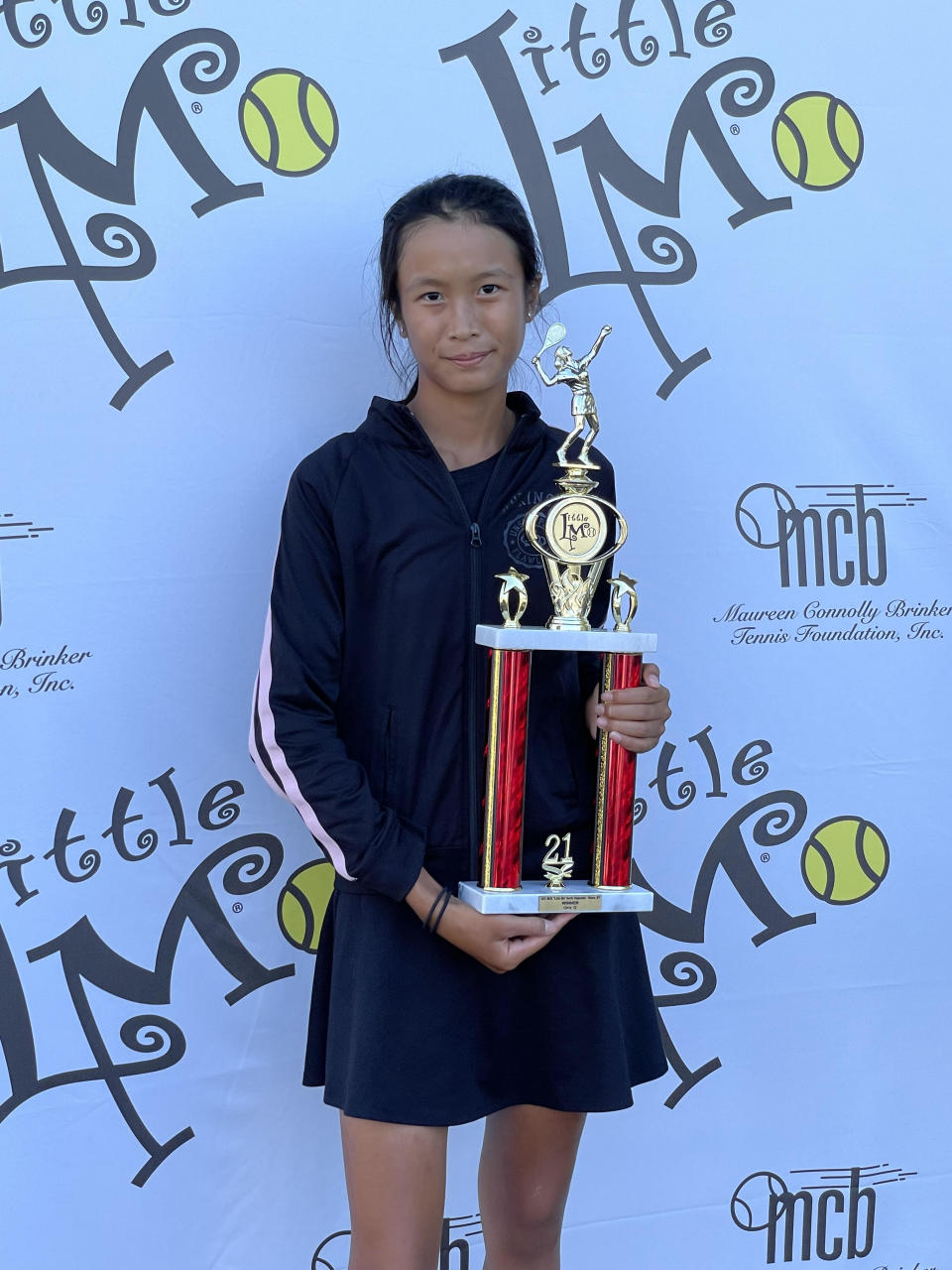 Hoo with one of her winning trophies, taken by her mom, May Voo.