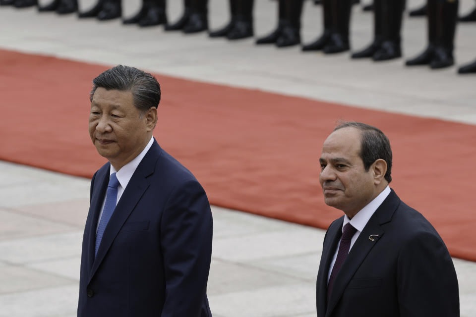 Chinese President Xi Jinping and Egyptian President Abdel Fattah el-Sissi, right, review the honour guard during a welcome ceremony at the Great Hall of the People in Beijing, China, Wednesday May 29, 2024. (Tingshu Wang/Pool Photo via AP)