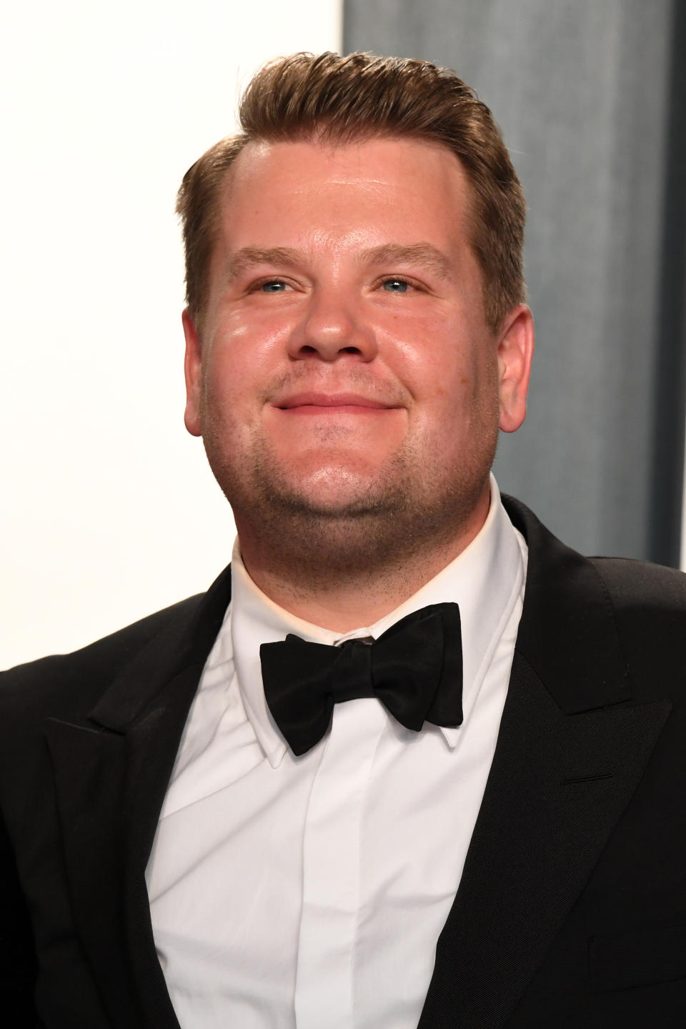 James Corden posing on a red carpet