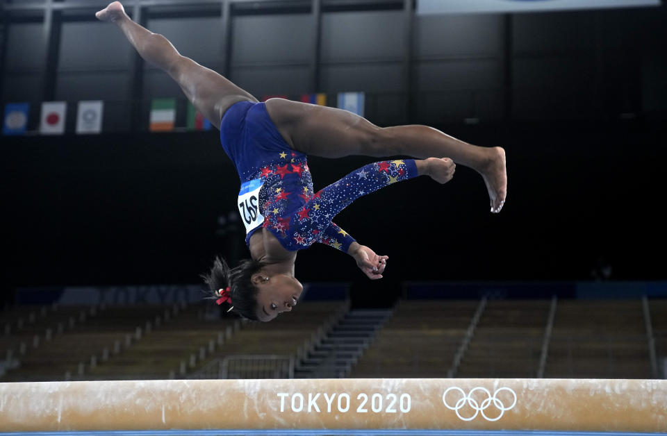 Simone Biles, of the United States, performs on the balance beam during the women's artistic gymnastic qualifications at the 2020 Summer Olympics, Sunday, July 25, 2021, in Tokyo. (AP Photo/Natacha Pisarenko)