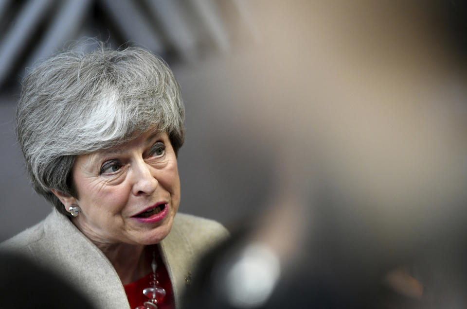 British Prime Minister Theresa May speaks with the media as she arrives for an EU summit at the Europa building in Brussels, Tuesday, May 28, 2019. European Union leaders are meeting in Brussels to haggle over who should lead the 28-nation bloc's key institutions for the next five years after weekend elections shook up Europe's political landscape. (AP Photo/Riccardo Pareggiani)