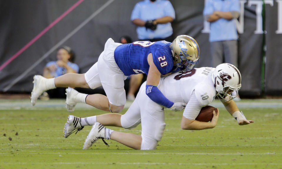 Central Michigan quarterback Cooper Rush (10) is sacked by Tulsa linebacker Craig Suits (28) in the first half of the Miami Beach Bowl NCAA college football game, Monday, Dec. 19, 2016, in Miami. (AP Photo/Alan Diaz)