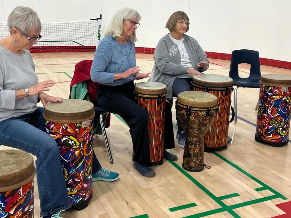 Saturday's events at the Canada Games Centre Whitehorse included two 15-minute drumming sessions teaching participants how to use the drum to celebrate, make music, heal, and have fun. (Sissi De Flaviis/CBC - image credit)