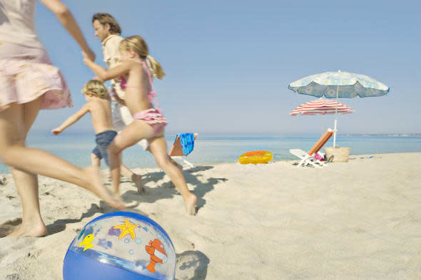 Family running on beach