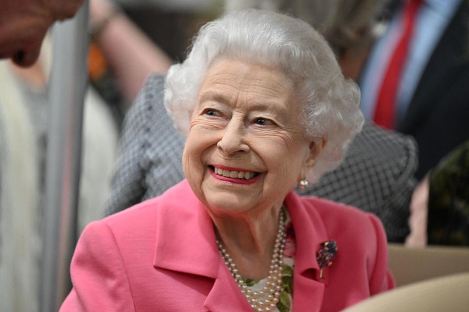 PAUL GROVER/POOL/AFP via Getty Queen Elizabeth smiles during a stop at the Chelsea Flower Show in 2022.