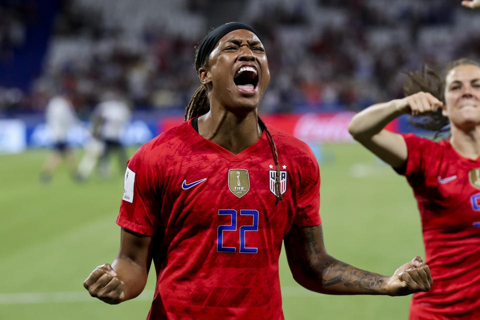 FILE - United States' Jessica McDonald celebrates the team's win in the Women's World Cup semifinal soccer match against England, at Stade de Lyon outside Lyon, France, July 2, 2019. McDonald was traded across six teams in her first five years as a single parent, making it difficult to find, let alone afford, child care in new cities. She and her then-8-month-old son were often forced to share a hotel room with a teammate — and sometimes she had no choice but to bring him with her to practice. (AP Photo/Francisco Seco, File)