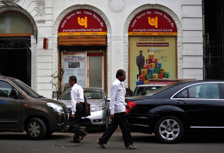 People walk past a Punjab National Bank branch in Mumbai, March 15, 2018. REUTERS/Francis Mascarenhas/Files