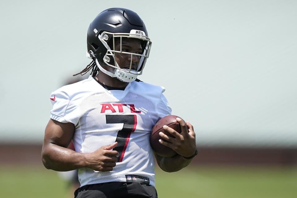 Atlanta Falcons running back Bijan Robinson (7) runs drills during the NFL football team's rookie minicamp, Saturday, May 13, 2023, in Flowery Branch, Ga. (AP Photo/Brynn Anderson)