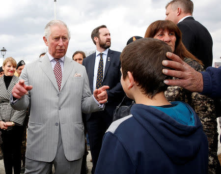 Britain's Prince Charles meet residents as he visit to the town of Amatrice, which was levelled after an earthquake last year, in central Italy April 2, 2017. REUTERS/Alessandro Bianchi