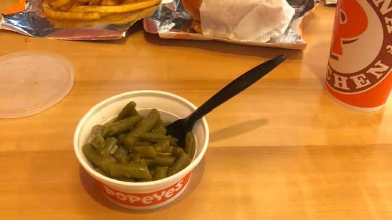 popeyes green beans in container