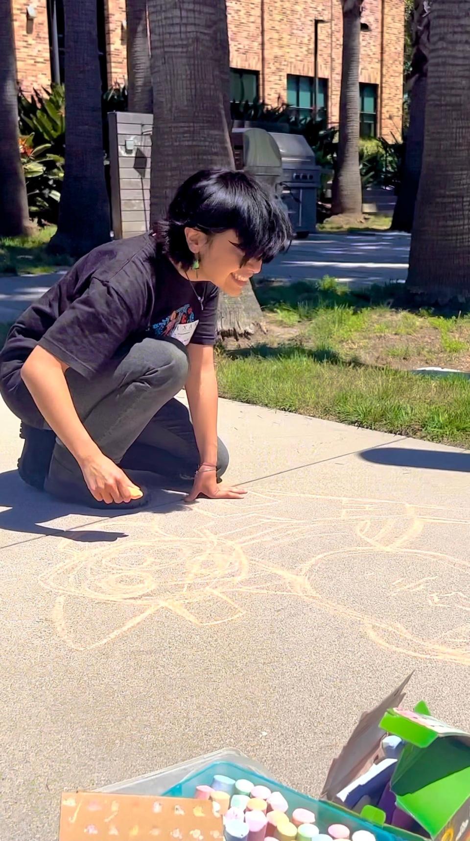 Jessie Plascencia with her chalk drawings