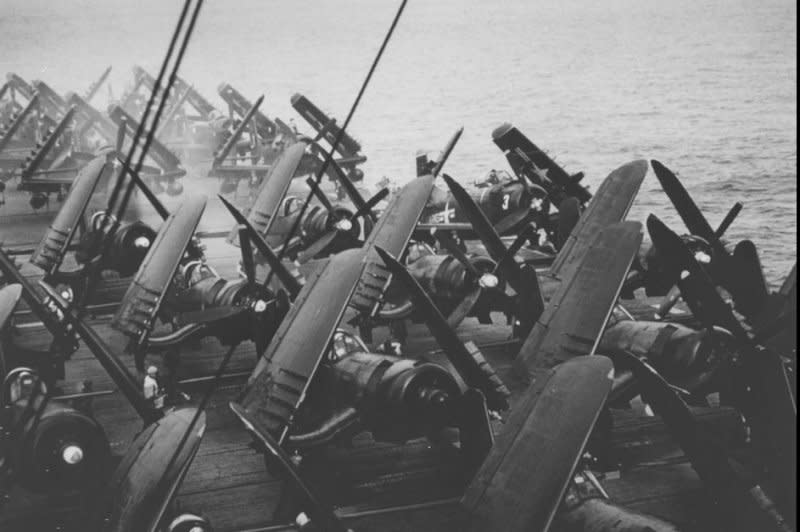 Vought AU-1 Corsair fighters are on the deck of the U.S. Navy light aircraft carrier USS Saipan in the South China Sea in 1954. On April 21, 1954, U.S. Air Force planes began flying French troops to Indochina to reinforce Dien Bien Phu. The city later fell to communist Viet Minh forces. File Photo by R.H. Spanier/U.S. Navy