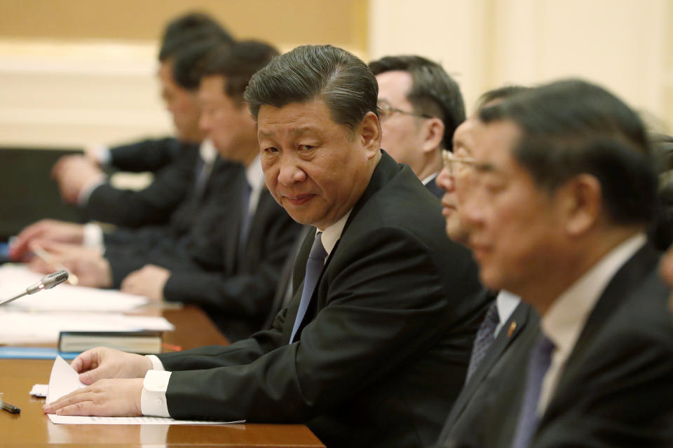 Chinese President Xi Jinping, center, attends the bilateral meeting with Myanmar State Counselor Aung San Suu Kyi, not in picture, at president house in Naypyitaw, Myanmar, Saturday, Jan. 18, 2020. (Nyein Chan Naing/Pool Photo via AP)