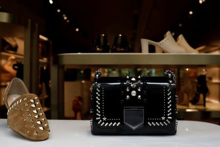 Products are displayed in the window of the Jimmy Choo store in New York City, U.S., April 24, 2017. REUTERS/Brendan McDermid