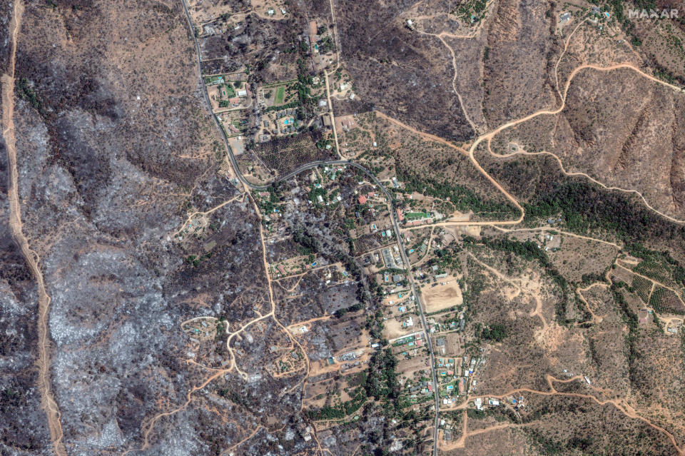 View of the wildfire damage in the Quebrada Escobares neighborhood on Monday. / Credit: Satellite image ©2024 Maxar Technologies