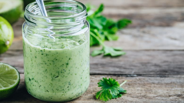 Green sauce in glass jar