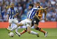 Britain Soccer Football - Hull City v Sheffield Wednesday - Sky Bet Football League Championship Play-Off Final - Wembley Stadium - 28/5/16 Hull City's Jake Livermore in action with Sheffield Wednesday's Fernando Forestieri Action Images via Reuters / Tony O'Brien Livepic EDITORIAL USE ONLY. No use with unauthorized audio, video, data, fixture lists, club/league logos or "live" services. Online in-match use limited to 45 images, no video emulation. No use in betting, games or single club/league/player publications. Please contact your account representative for further details.