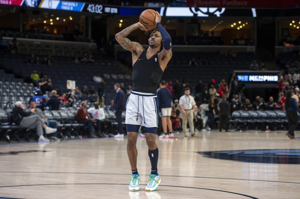 Memphis Grizzlies guard Ja Morant warms up before an NBA basketball game against the Houston Rockets, Wednesday, March 22, 2023, in Memphis, Tenn. (AP Photo/Brandon Dill)