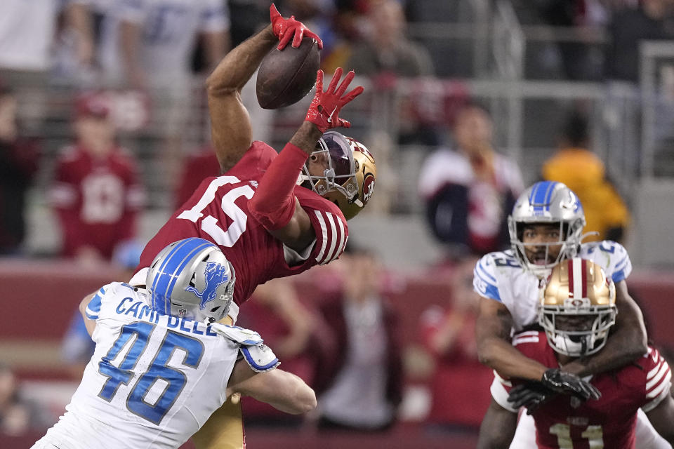San Francisco 49ers wide receiver Jauan Jennings (15) catches a pass against Detroit Lions linebacker Jack Campbell (46) during the second half of the NFC Championship NFL football game in Santa Clara, Calif., Sunday, Jan. 28, 2024. (AP Photo/Mark J. Terrill)