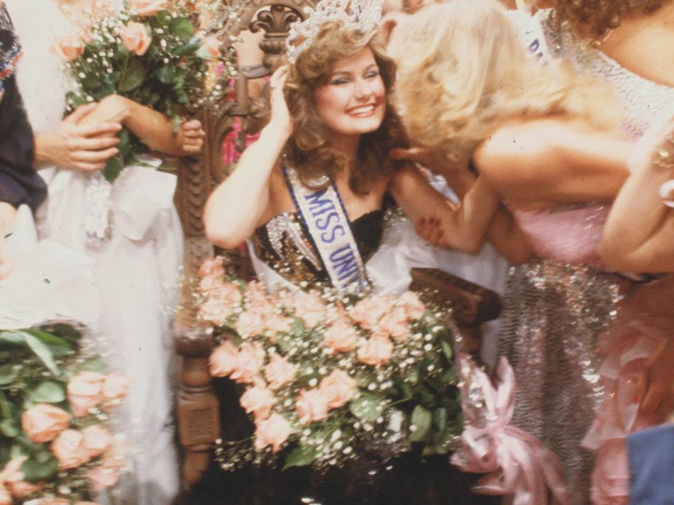 Karen Baldwin, the former Miss Canada, sits on her throne after winning the title of Miss Universe 1982.