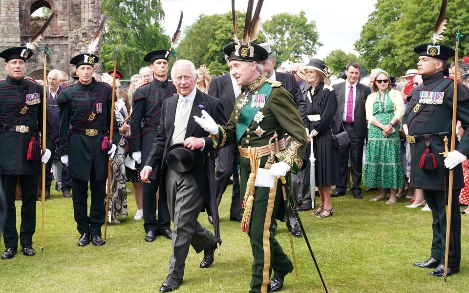 The Prince of Wales during a garden party at the Palace of Holyroodhouse in Edinburgh on Wednesday - PA