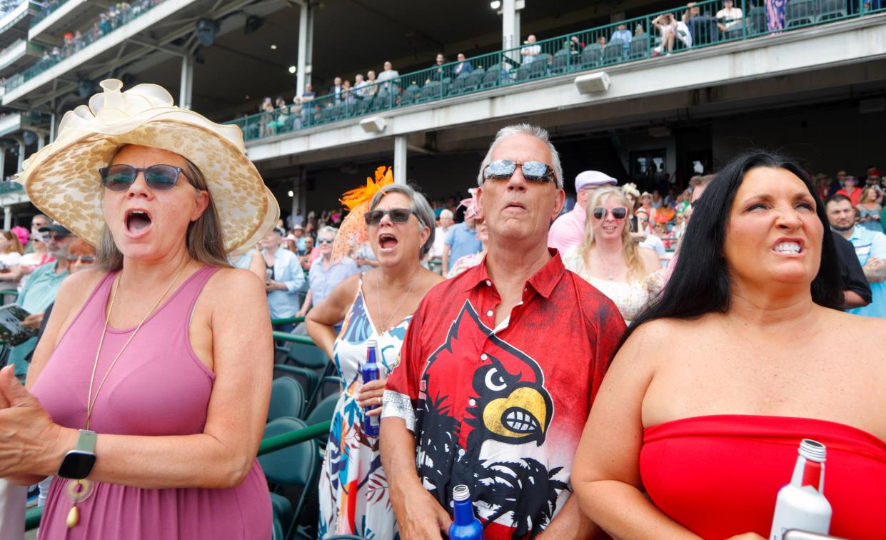 Stephanie McGiveney, right, Steve Carroll his wife Cheryl and Donna Trusty, left, cheer on their horse in the Village 8 Theaters race at 502’sDay at Churchill Downs. 
April 30, 2024
