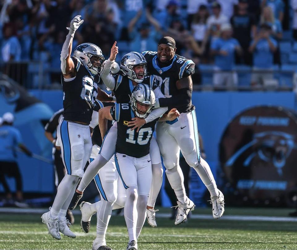 Players celebrate Carolina Panthers place kicker Eddy Pineiro’s game winning field goal at the Bank of America Stadium in Charlotte, N.C., on Sunday, October 29, 2023.
