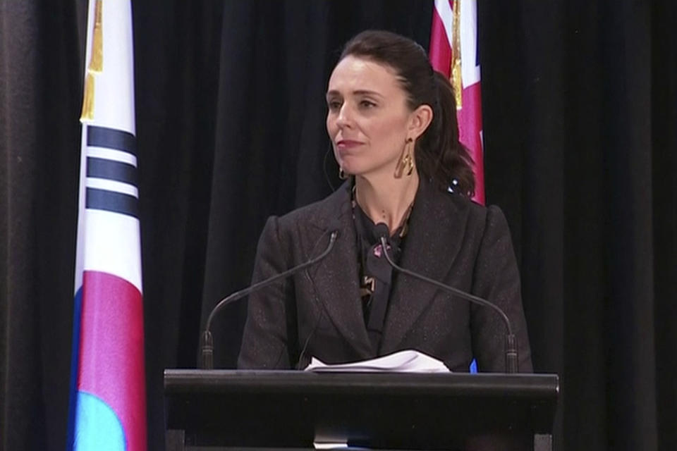 In this image made from a video, New Zealand's Prime Minister Jacinda Ardern listens during a joint news conference with South Korean President Moon Jae-in in Auckland, New Zealand Tuesday, Dec. 4, 2018. Ardern says New Zealand will soon allow smoother immigration procedures for visitors from South Korea and plans to improve pension portability between the two countries. (NZ POOL via AP)