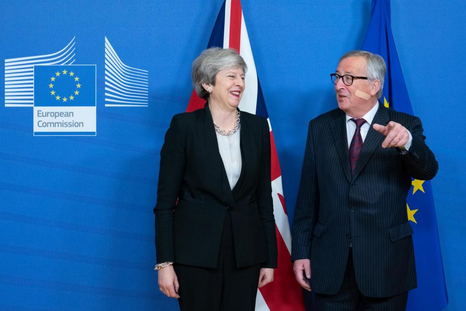 War wounds: Theresa May and Jean-Claude Juncker in Brussels yesterday (Bloomberg via Getty Images)