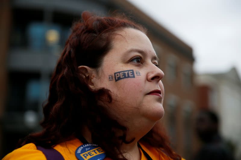 Pete Buttigieg supporter Caroline Benton stands outside the tenth Democratic 2020 presidential debate at the Gaillard Center in Charleston