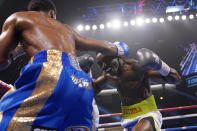 Shakur Stevenson hits Jeremiah Nakathila, of Namibia, in a WBO interim junior lightweight title fight Saturday, June 12, 2021, in Las Vegas. (AP Photo/John Locher)