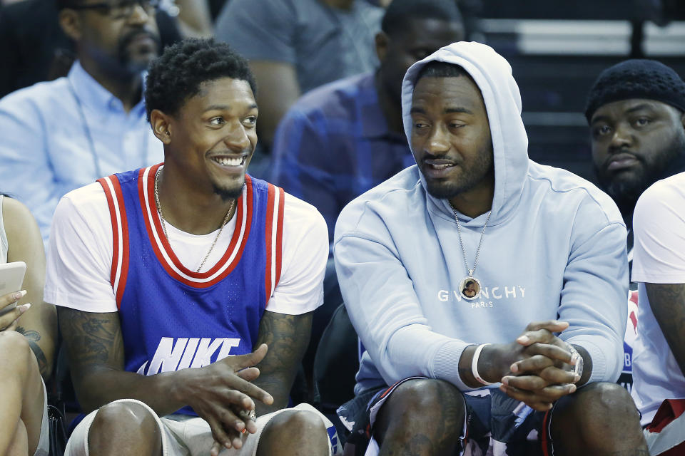 Neither Bradley Beal nor John Wall will be in uniform when the Wizards reopen the season in Orlando. (Michael Reaves/Getty Images)