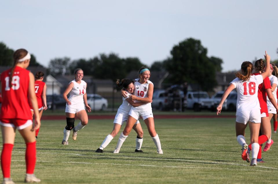 Chatham Glenwood's Rylann Law (10) celebrates a goal with teammate Karley Hawkins during the Class 2A supersectional against Troy Triad on Tuesday, May 30, 2023.