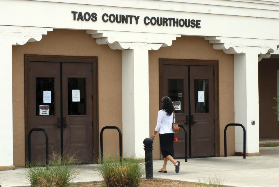 The Taos County Courthouse, where three people accused of child abuse at a desert compound are awaiting release, is shown Wednesday, Aug. 15, 2018, in Taos, N.M. Security was boosted at the judiciary complex amid threats against the state judge who cleared the way for the defendants to leave jail. (AP Photo/Morgan Lee)